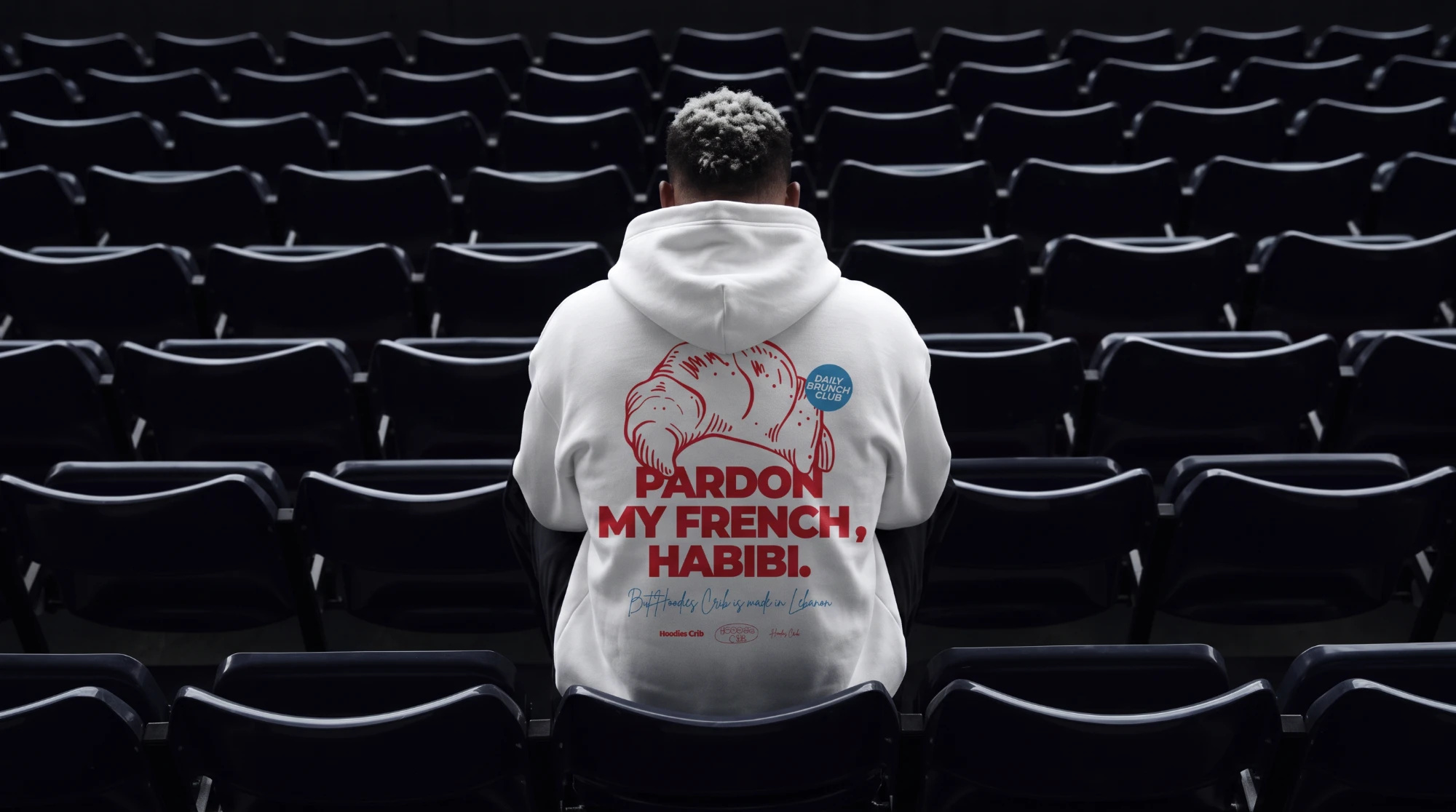 AI-generated lifestyle photo of a hoodie print design in an empty stadium